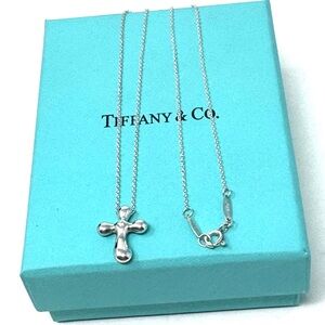 Authentic Tiffany & CO. Elsa Perettii 1P Diamond Cross Pendant necklace.